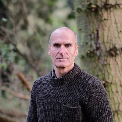 Glen Monks, functional therapist, in a wooded setting